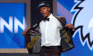 Jun 23, 2016; New York, NY, USA; Kris Dunn (Providence) shows off the inside of his coat after being selected as the number five overall pick to the Minnesota Timberwolves in the first round of the 2016 NBA Draft at Barclays Center. Mandatory Credit: Brad Penner-USA TODAY Sports ORG XMIT: USATSI-269318 ORIG FILE ID: 20160623_jel_ae5_060.jpg