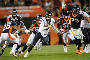 Brock Osweiler (17) of the Houston Texans scrambles against the Denver Broncos defense during the third quarter on Monday, October 24, 2016. The Denver Broncos hosted the Houston Texans. Joe Amon, The Denver Post