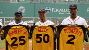 Boston Red Sox All-Stars, left to right, Jackie Bradley Jr., Mookie Betts and Xander Bogaerts hold up their jersey's before the baseball game against the Tampa Bay Rays at Fenway Park in Boston Sunday, July 10, 2016. (AP Photo/Winslow Townson)
